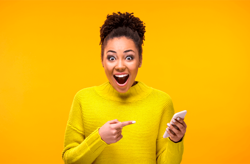 Smiling woman with smartphone